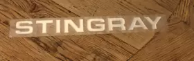 156953-01 Stingray New Boat Company 156953 1.2 Inch Tall X 13 Long Silver Raised Decal Emblem