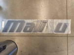 Emblem Malibu Graphite-lg (missing "b") New. Price: $100.00.