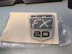 New Authentic Skeeter Emblem FX20 Black/ Chrome 4"-91171510. Price: $40.00.